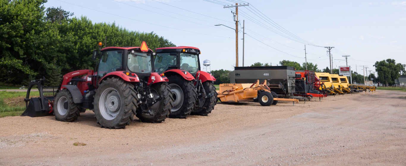 Red tractors in line